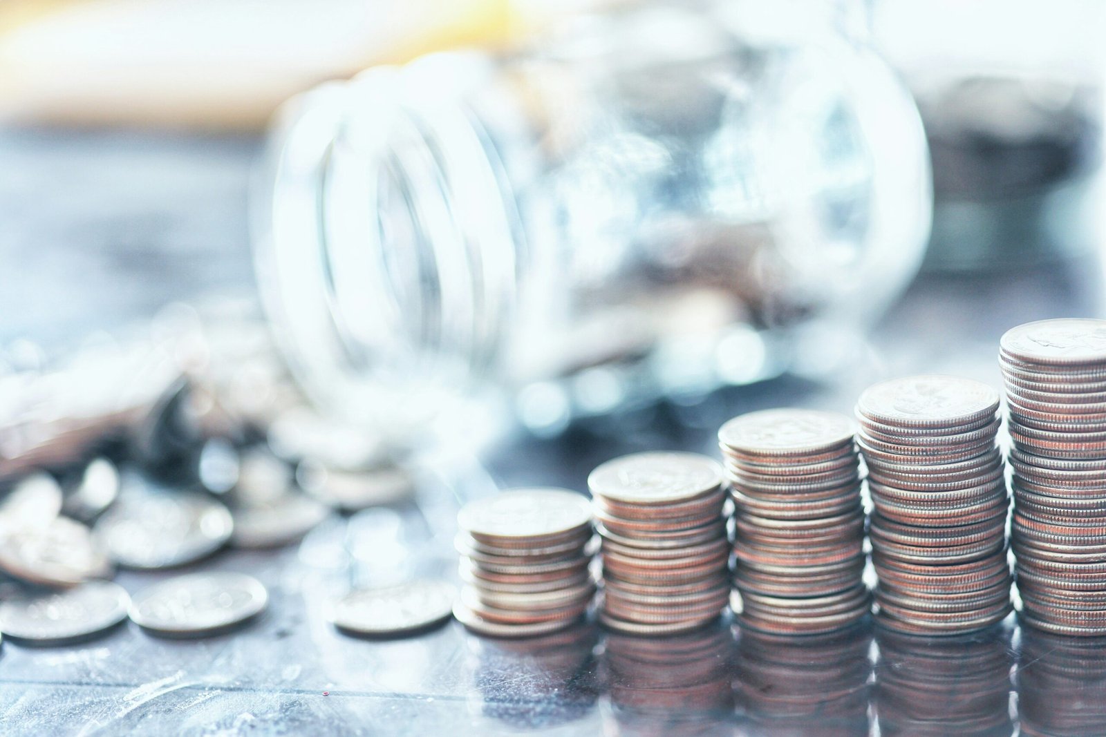 Coins stacked neatly on a table showing earned interest